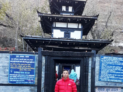 taking picture in front of holy temple of Muktinath during the visit.