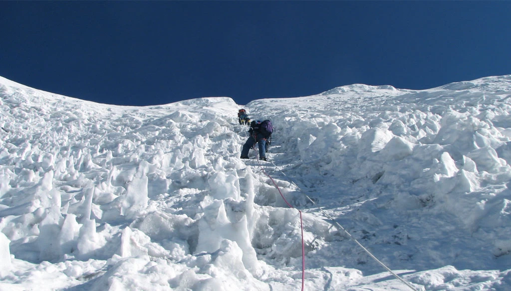 Traversing through steep section of Island peak during the climb.