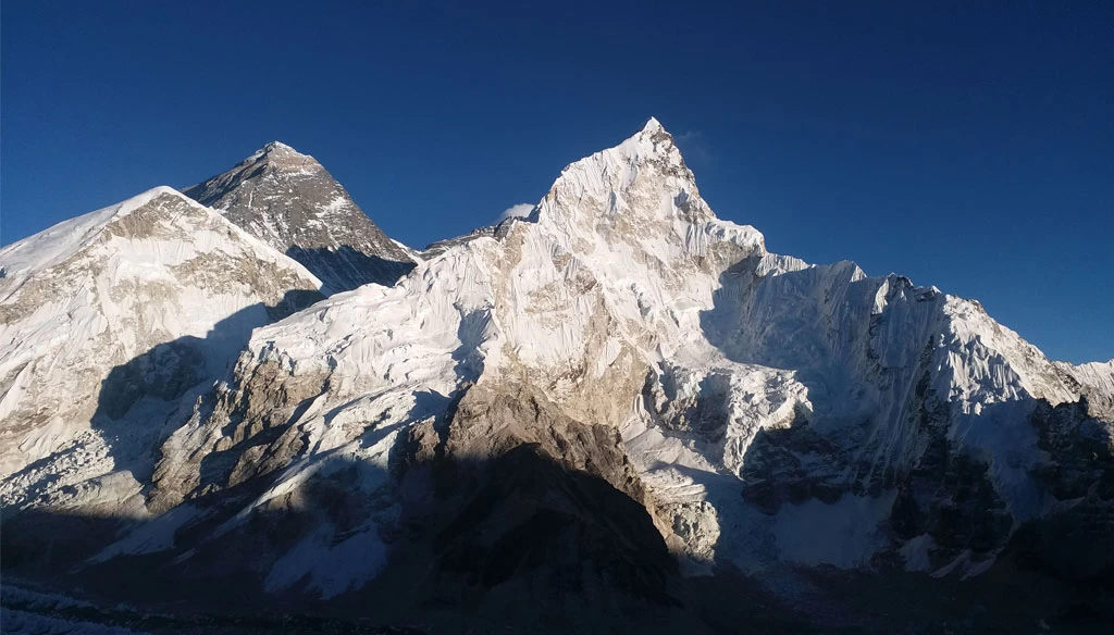 A breathtaking morning view of Mount Everest, Nuptse is pictured from Kala Patthar during the Island peak climbing with Everest base camp trek.