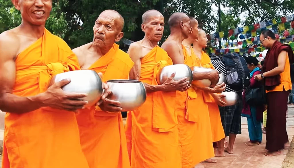 alms giving ceremony during buddha jayanti festival