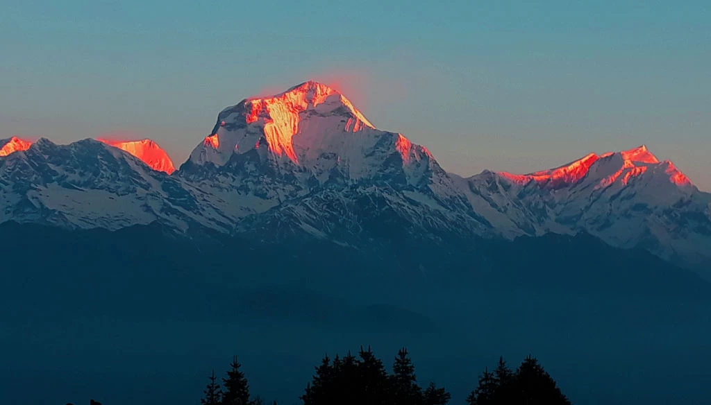 The orange color of Mount Dhaulagiri from Poon Hill in Annapurna region.