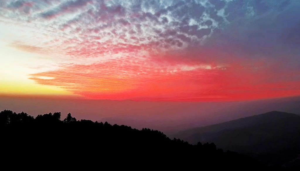 a beautiful red and orange colored clouds captured during sunset in nagarkot