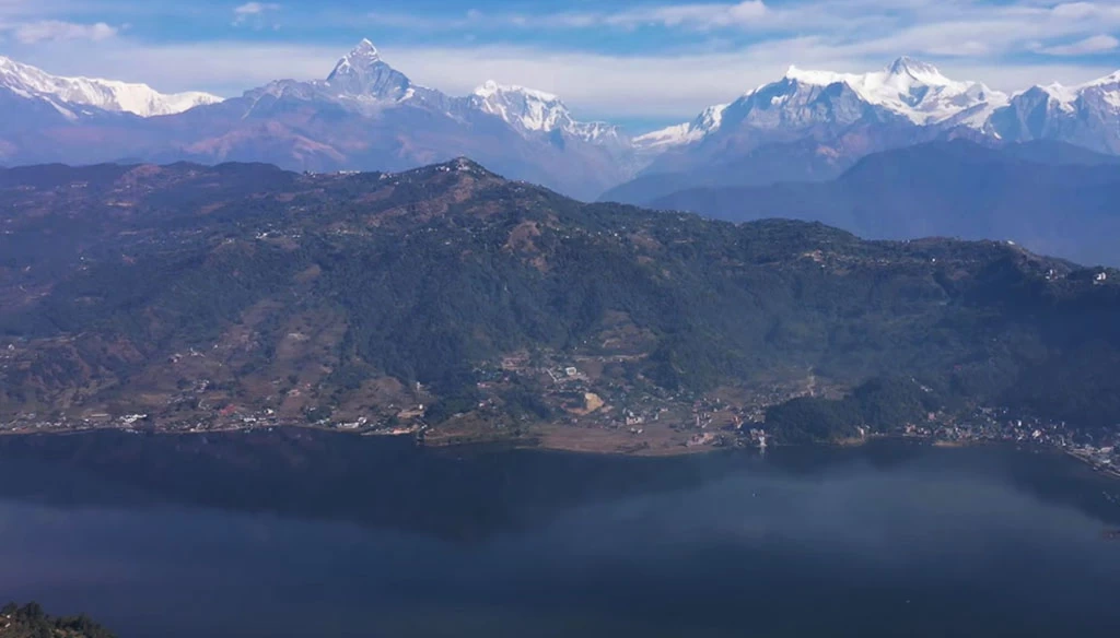 a beautiful fewa lake and annapurna mountain range is seen from peace stupa pokhara