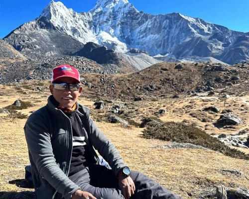 Sherpa Guide Infront Of Mount Amadablam
