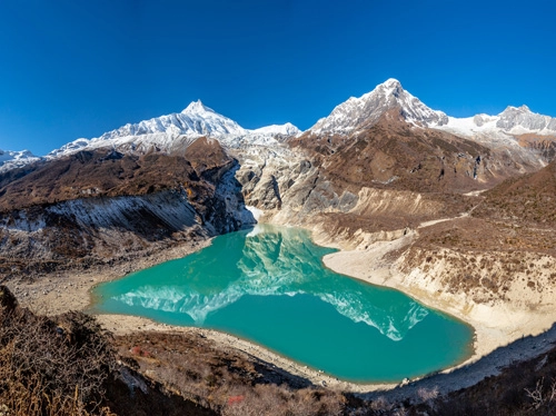 a Beautiful Reflection of Mount Manaslu and Naike peak on the Birendra Lake.